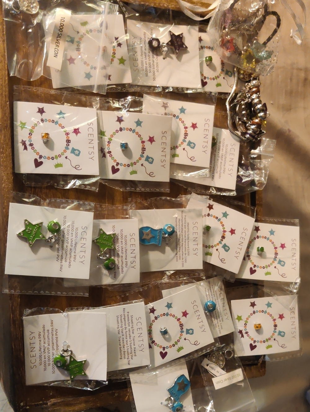 A Group Of Scentsy Charms